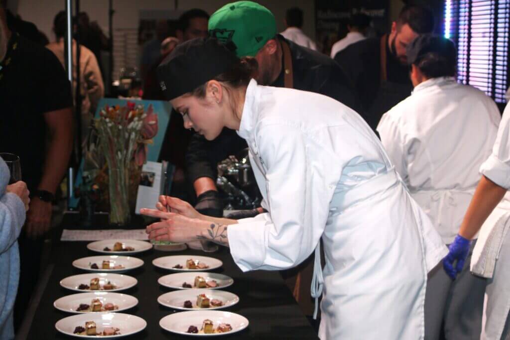 Culinary student plating food