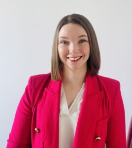 Female graduate smiling in business suit
