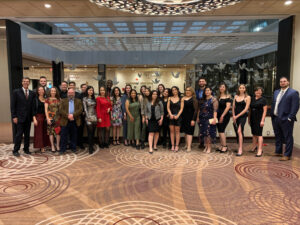 Students and faculty stand together for a photo at the Sheraton Centre before the celebratory gala.