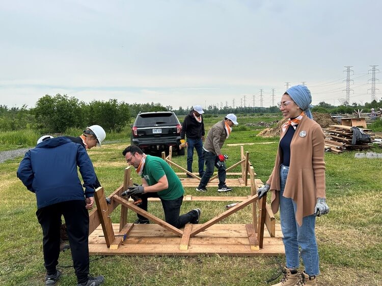 Group building a picnic table
