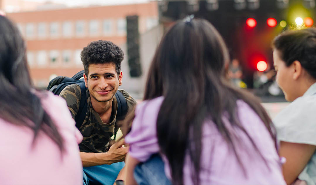 Group of students listening to music and hanging out together at AC Day 1. 