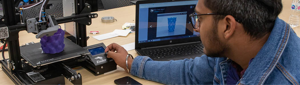 Student working on a 3D printed object in the ARIE studio.