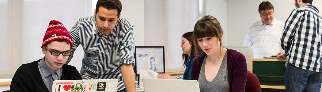 Two people speaking together in a private office. 