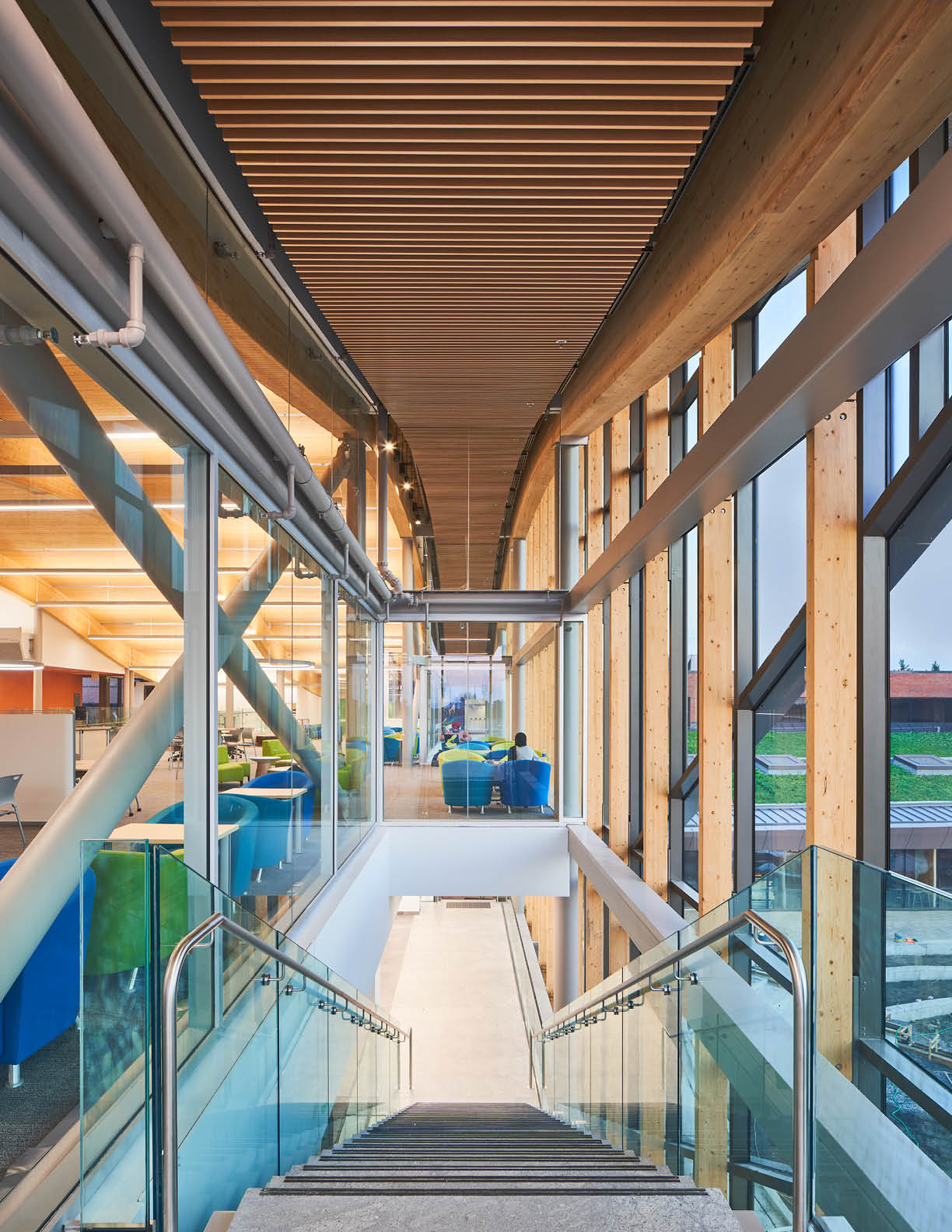 Student sitting in the AC Hub smiling at the camera. 