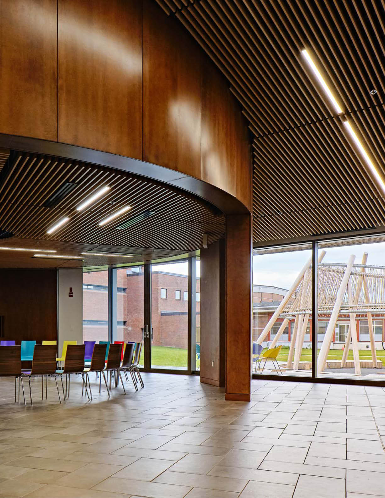 Student sitting in the AC Hub smiling at the camera. 