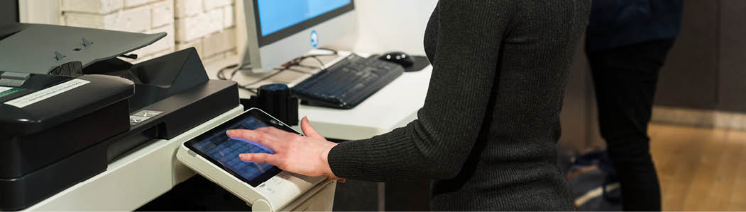Close-up of a student on a college printer.