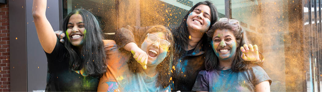 Photo of a student pulling supplies out of their locker.