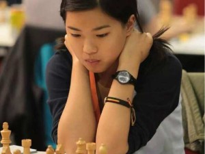 U14 Girls Champion Qiyu Zhou -  photo of her playing chess