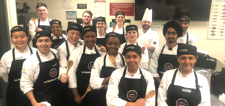 group picture of Bachelor of Culinary Arts and Food Science program students who volunteered to prepare meals for the Ottawa Food Bank in partnership with La Tablées Des Chefs