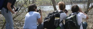 outdoor adventurer naturalist students with binoculars