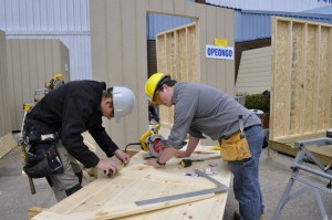 Students building an outdoor shed