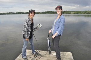 Two female Environmental Technician students posing with a YSI at Muskrat Lake