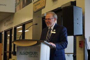 Algonquin College President Claude Brulé speaks at the Pembroke Waterfront Campus tenth anniversary celebration.