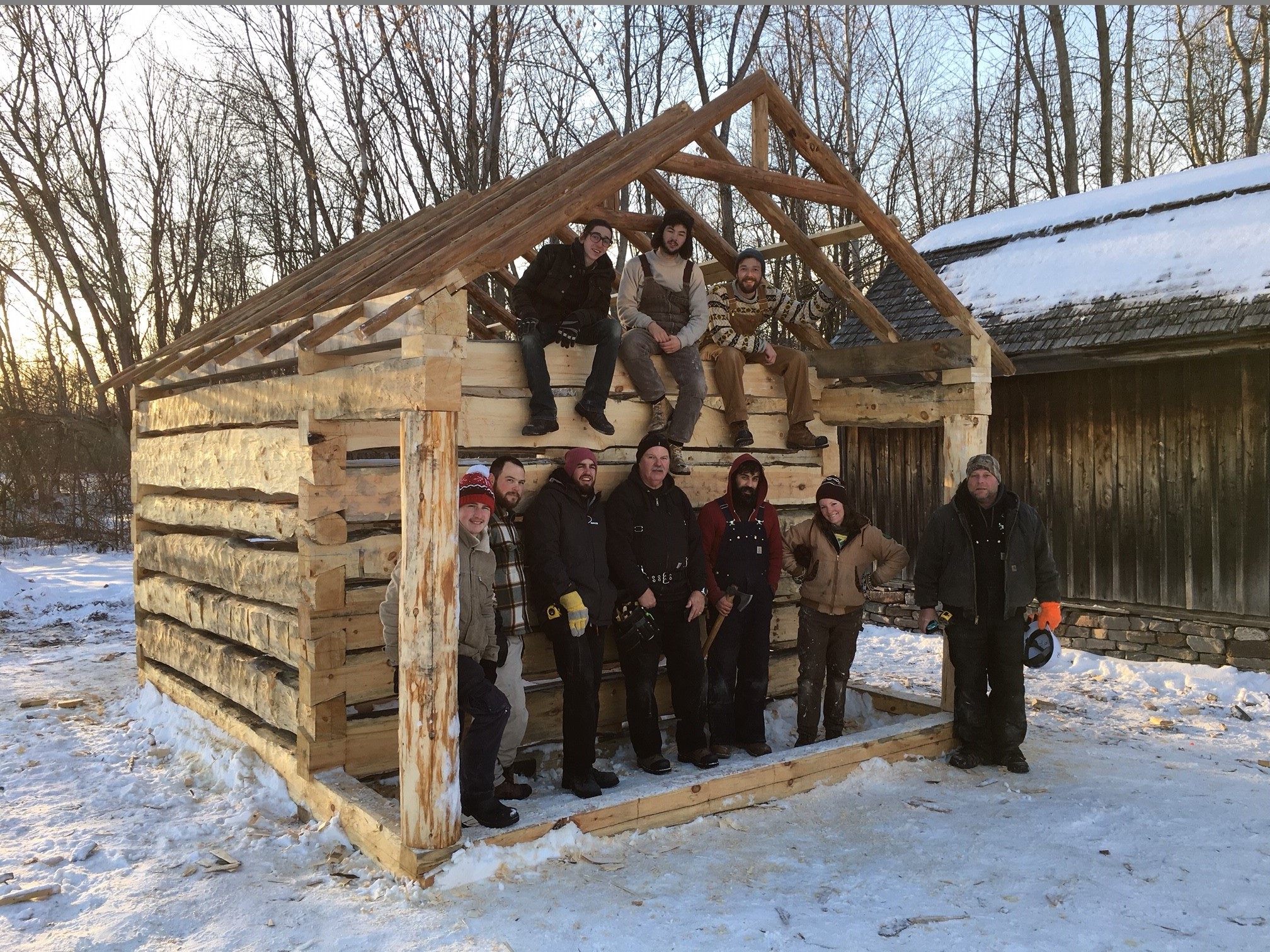 2017 Heritage Carpentry students in front of timber frame build