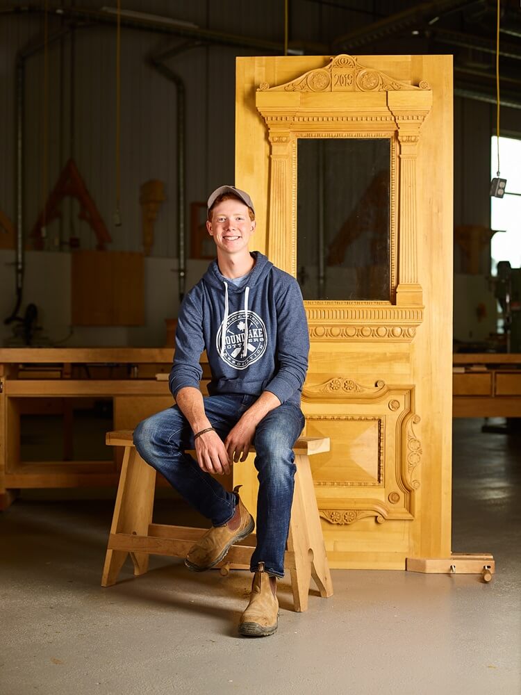 Matthew Bruins poses in front of his project