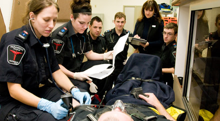 Students conducting assesment in Ambulance simulator