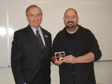 Rich Lauzon receiving award from President Gillet