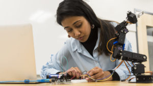 Electro-Mechanical student in lab