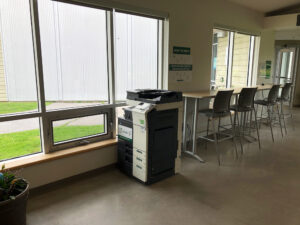 Image of a Konica Minolta colour printer on the first floor of the Perth campus located in the common area room 128.