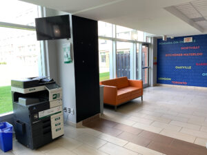 Image of a Konica Minolta colour printer on the first floor of Residence located at the far side of the main lobby.