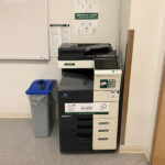 Image of a Konica Minolta black and white printer on the fourth floor of the Pembroke campus located inside room 434.