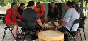 drummers sit in a circle at Pembroke campus marking National Indigenous People's Day